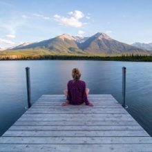 Lady sitting on a dock