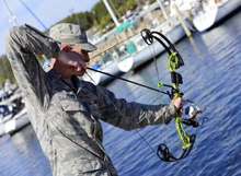 Man holding bow fishing kit