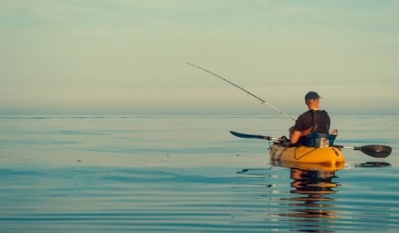 Person Fishing on Kayak